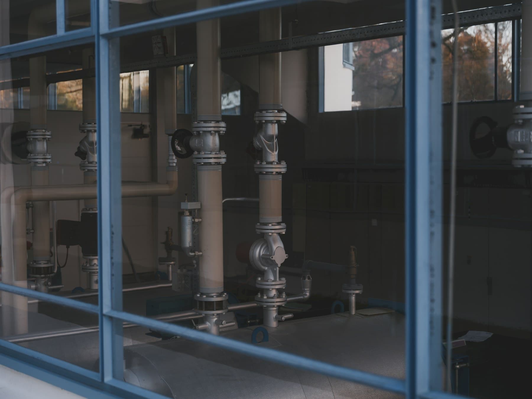 Industrial piping and machinery inside a production facility