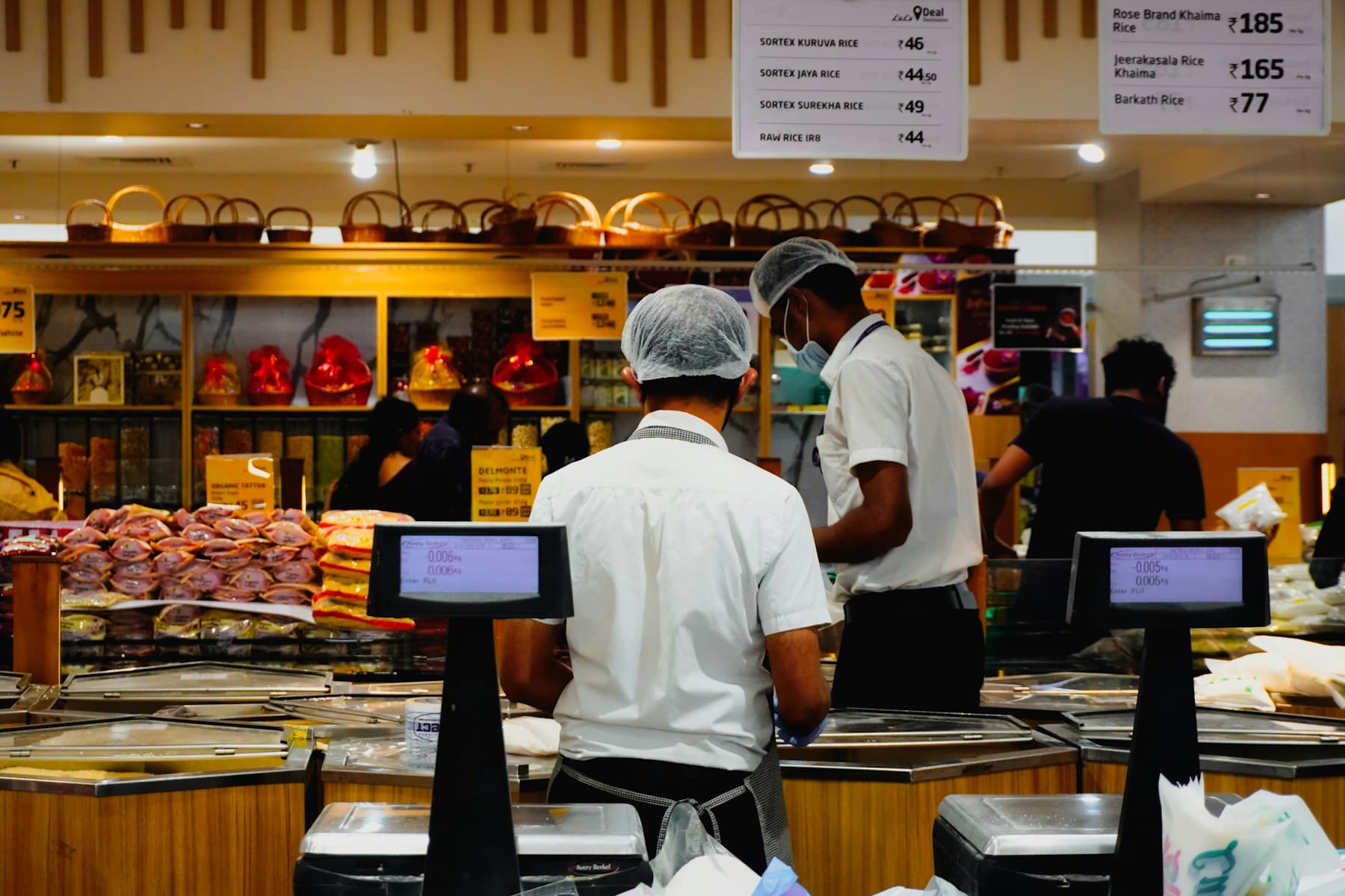Retail team working at a supermarket checkout area